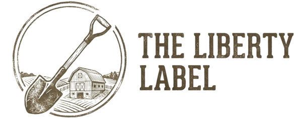 Logo of 'The Liberty Label' with a shovel and barn illustration on a white background